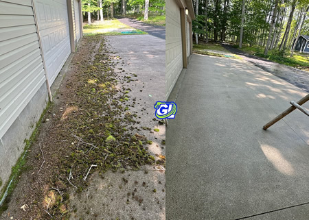 Freshly rinsed concrete driveway after professional cleaning in traverse city